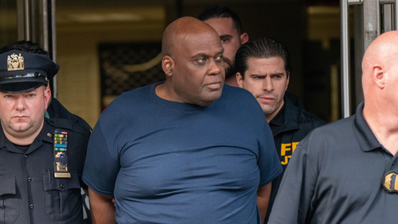 Frank James is escorted out of the 9th Precinct by police after his arrest in New York on April 13.